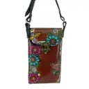 PORTACEL VAQUETA CINCELADA